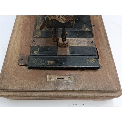 86 - An American White Sewing Machine Company sewing machine, lacking wooden case, 44 cm wide Provenance:... 