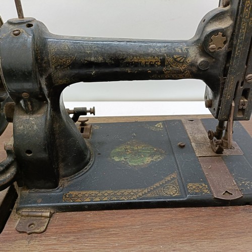 86 - An American White Sewing Machine Company sewing machine, lacking wooden case, 44 cm wide Provenance:... 