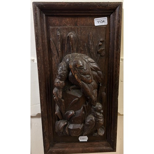 361 - A pair of carved oak panels, decorated game, 48 x 25 cm