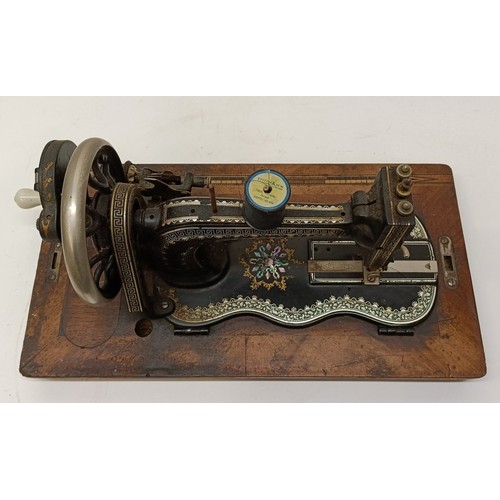 85 - A late 19th/early 20th century sewing machine, lacking wooden case, 50 cm wideProvenance:  A single ... 