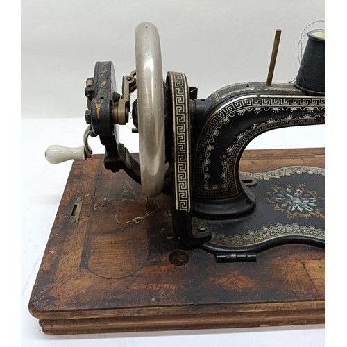 85 - A late 19th/early 20th century sewing machine, lacking wooden case, 50 cm wideProvenance:  A single ... 