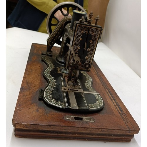 85 - A late 19th/early 20th century sewing machine, lacking wooden case, 50 cm wideProvenance:  A single ... 