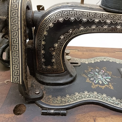 85 - A late 19th/early 20th century sewing machine, lacking wooden case, 50 cm wideProvenance:  A single ... 