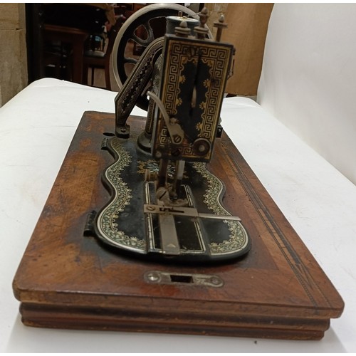 85 - A late 19th/early 20th century sewing machine, lacking wooden case, 50 cm wideProvenance:  A single ... 