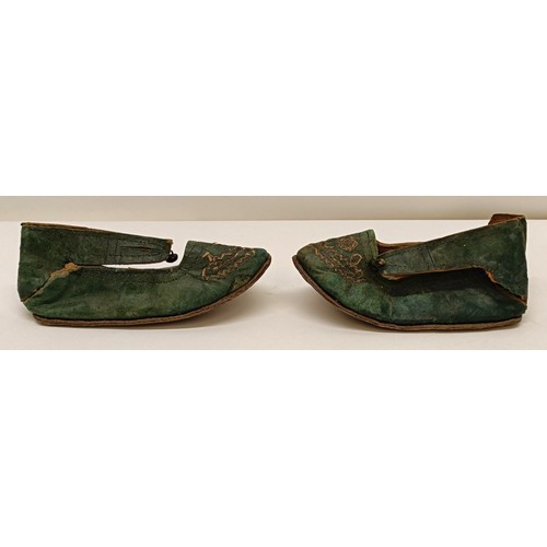 138 - A pair of Chinese childs leather and silk embroidered shoes