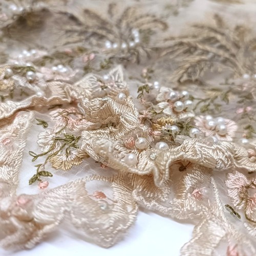 33 - A delicately embroidered piece of fabric, decorated corn and applied simulated pearls Provenance:  A... 