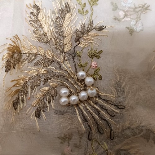 33 - A delicately embroidered piece of fabric, decorated corn and applied simulated pearls Provenance:  A... 