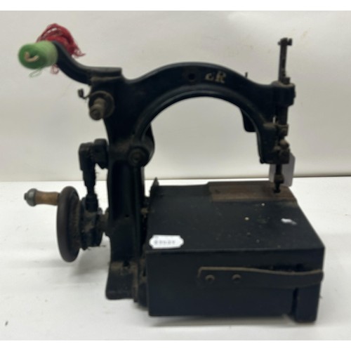 68 - A 19th century table top sewing machine, 30 cm wide Provenance:  A single owner collection, from the... 