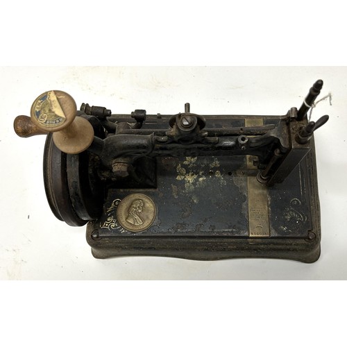 69 - A 19th century sewing machine, 32 cm wide Provenance:  A single owner collection, from the stud... 