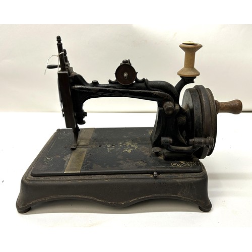 69 - A 19th century sewing machine, 32 cm wide Provenance:  A single owner collection, from the stud... 