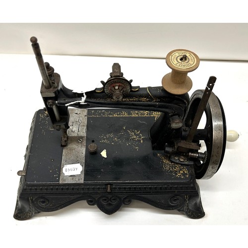 71 - A 19th century table top sewing machine, 31 cm wide Provenance:  A single owner collection, fro... 