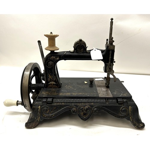 71 - A 19th century table top sewing machine, 31 cm wide Provenance:  A single owner collection, fro... 