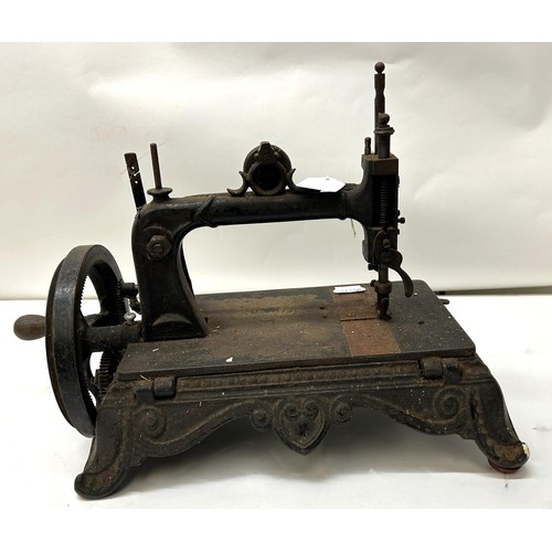 72 - A 19th century sewing machine, 30 cm wide Provenance:  A single owner collection, from the stud... 