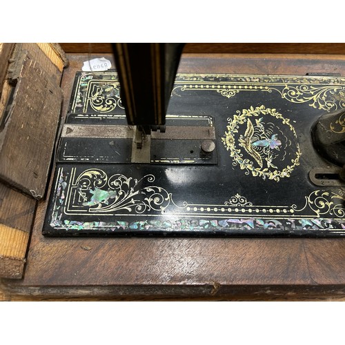 79 - A late 19th/early 20th century sewing machine, lacking wooden case, 48 cm wide Provenance:  A s... 