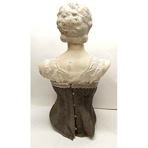 50 - A plaster female bust, shop display size, with a lace trimmed corset, 75 cm highProvenance:  A singl... 