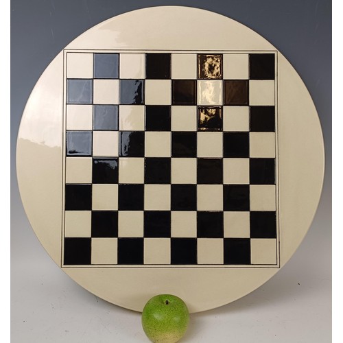 417 - A Dennis Chinaworks chess board, 58 cm diameter