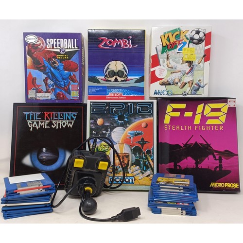 420 - An Atari 520STE, boxed, and assorted games, to include The Killing Game Show, Epic, Speedball 2, Zom... 