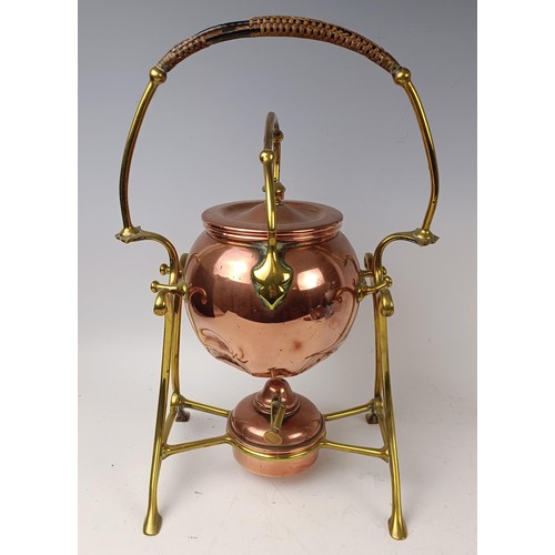 423 - An Arts and Crafts style copper kettle on a stand, 35 cm