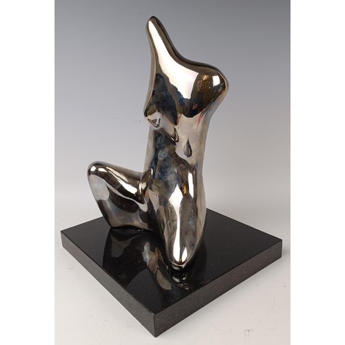 426 - A late 20th century limited edition plated model of a female torso, numbered 1/7, on a polished slat... 