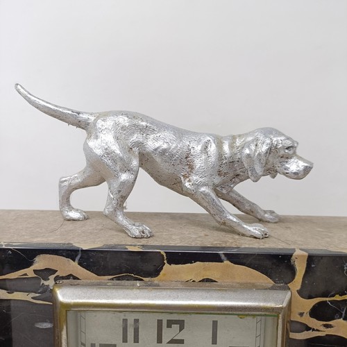 436 - An Art Deco clock garniture, the clock with a dog finial, 30 cm wide (3)