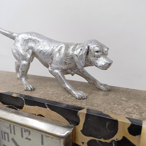 436 - An Art Deco clock garniture, the clock with a dog finial, 30 cm wide (3)