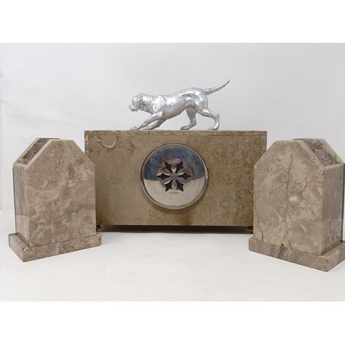 436 - An Art Deco clock garniture, the clock with a dog finial, 30 cm wide (3)