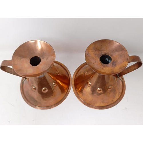 415 - A pair of Liberty Arts & Crafts copper chamber candlesticks, of conical form, 13.5 cm high (2)