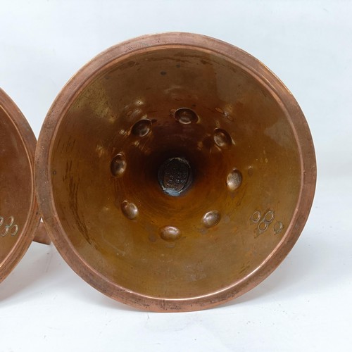 415 - A pair of Liberty Arts & Crafts copper chamber candlesticks, of conical form, 13.5 cm high (2)