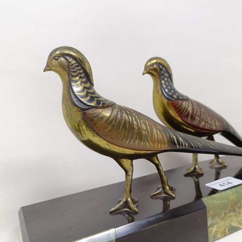 414 - A pair of painted silver coloured metal pheasants, on a marble base, 40 cm wide