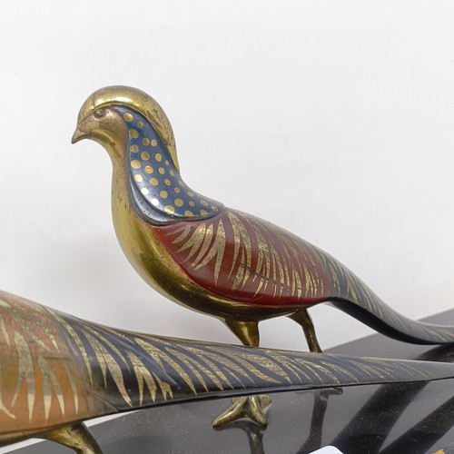 414 - A pair of painted silver coloured metal pheasants, on a marble base, 40 cm wide