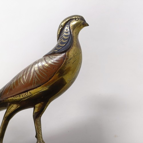 414 - A pair of painted silver coloured metal pheasants, on a marble base, 40 cm wide