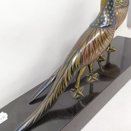 414 - A pair of painted silver coloured metal pheasants, on a marble base, 40 cm wide