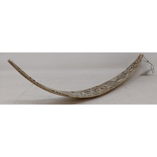 523 - An Indonesian bone calendar, decorated reptiles, 40.5 cm wide