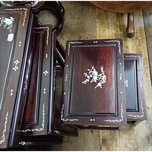 715 - A nest of four Chinese occasional tables, inlaid with mother of pearl, the largest 50.5 cm wide