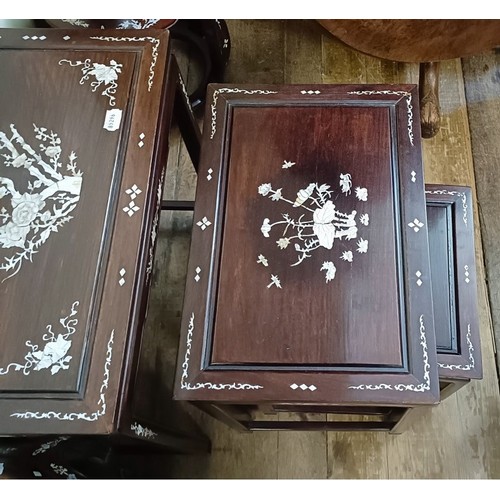 715 - A nest of four Chinese occasional tables, inlaid with mother of pearl, the largest 50.5 cm wide