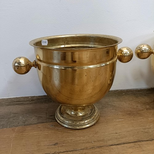 535 - A pair of brass champagne buckets, 28 cm diameter (2)