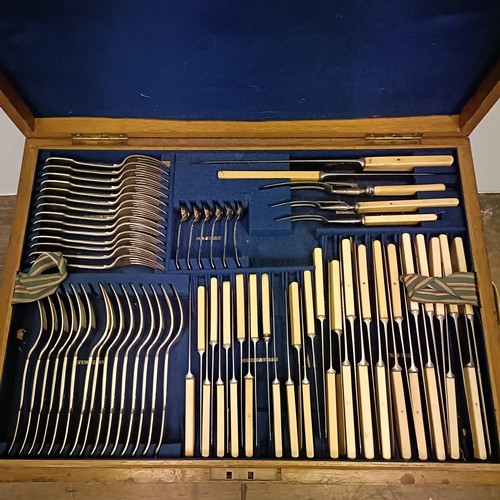 646 - A canteen of cutlery, in an oak case, incorporating a four piece tea service