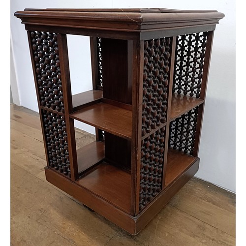 683 - A mahogany revolving bookcase, by J Shoolbred & Co, 56 cm wide