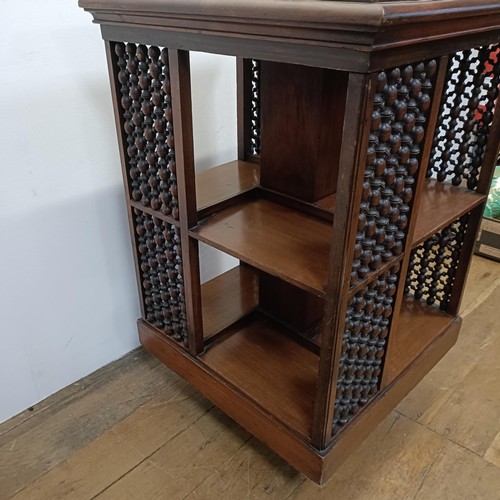 683 - A mahogany revolving bookcase, by J Shoolbred & Co, 56 cm wide