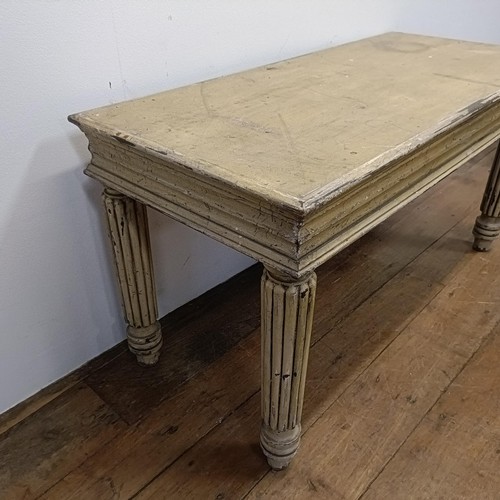 687 - A painted hall table, on reeded legs, 100 cm wide