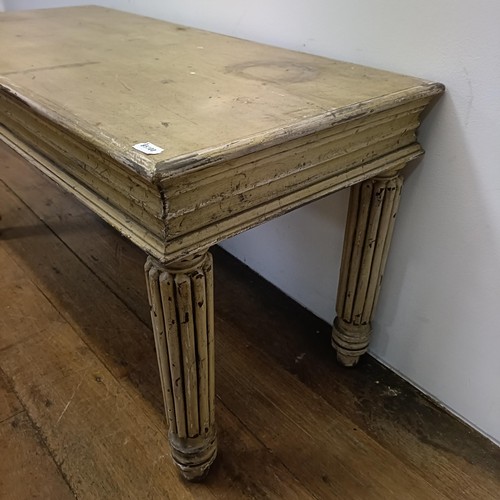 687 - A painted hall table, on reeded legs, 100 cm wide