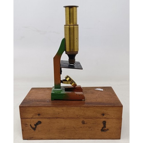 534 - A 19th century students microscope, another microscope, two cameras, a pair of opera glasses, assort... 