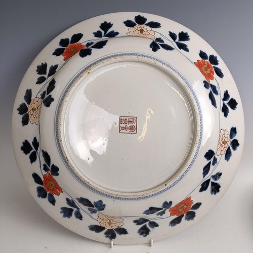 544 - A Japanese charger, 46 cm diameter, and two 19th century Spode New Stone stands (3)