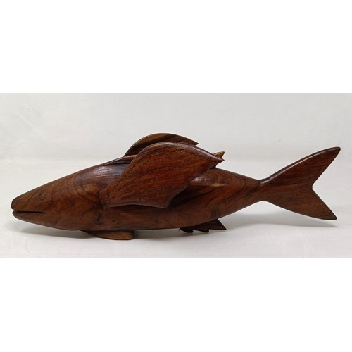 602 - A carved wood Pitcain Islands type fish, John Christian, 40 cm wide