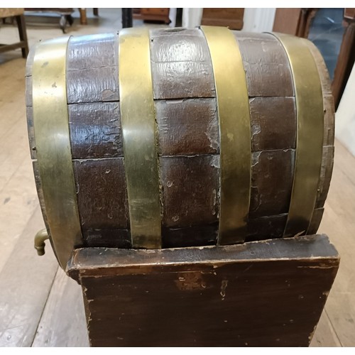 601 - A late 19th/early 20th century Continental brass bound barrel on stand, 33 cm wide