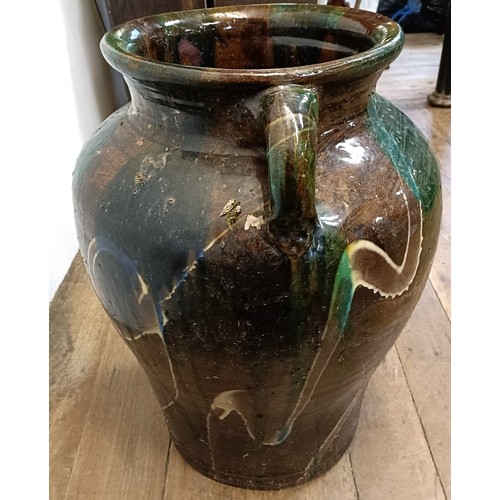 600 - A large glazed pottery two handled urn, 60 cm high