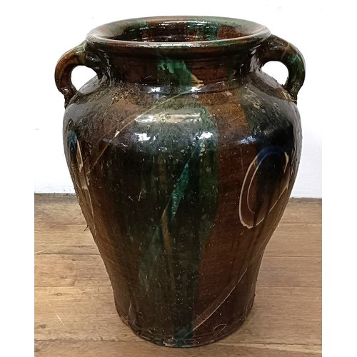 600 - A large glazed pottery two handled urn, 60 cm high