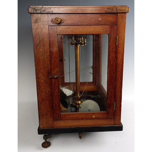 589 - A set of laboratory scales, in a mahogany case, 37 cm wide