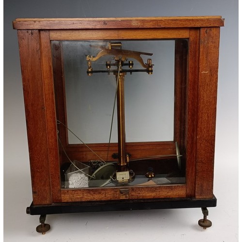 589 - A set of laboratory scales, in a mahogany case, 37 cm wide