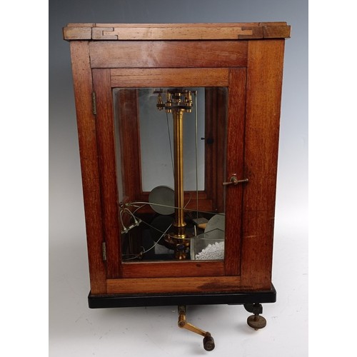 589 - A set of laboratory scales, in a mahogany case, 37 cm wide